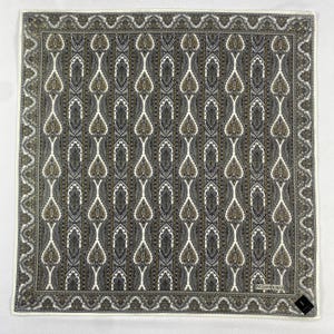 May include: Square scarf featuring a repeating paisley pattern in grey, white, and brown. The scarf has a white border with a decorative edge. The brand name "YVES SAINT LAURENT" is visible in the lower right corner.