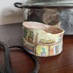 Clay bangle bracelet featuring a hand painted bookcase scene, wearable whimsical clay art image 2