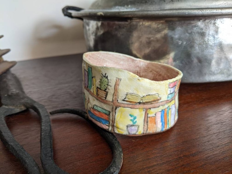 Clay bangle bracelet featuring a hand painted bookcase scene, wearable whimsical clay art image 2