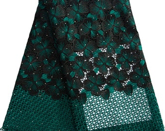 May include: Black and green floral lace fabric with a mesh design. The lace has a delicate floral pattern with small beads.
