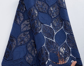 May include: Navy blue lace fabric with a leaf pattern and silver sequins.