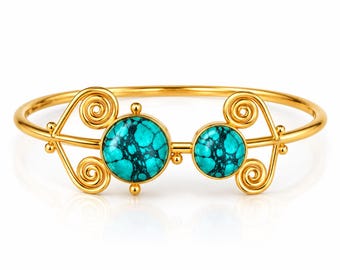 May include: A gold-toned cuff bracelet featuring two round, turquoise-colored stones with dark veining. The metalwork includes symmetrical, swirling wire designs on both sides of the stones, creating an open, decorative frame for the gems.