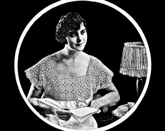 May include: A black and white photo of a woman wearing a crocheted top, sitting in a chair and reading a book. A lamp with a fringed shade is in the background.