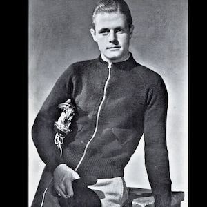 May include: A black zip-up sweater with a high collar and a pocket on the left side. The sweater is made of a knit fabric and has a relaxed fit.