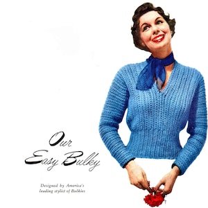 May include: A blue crocheted sweater with a V-neck and long sleeves. The sweater is being worn by a woman with a blue scarf around her neck. The text "Our Easy Bulky" is written below the image. The text "Designed by America's leading stylist of Bulky" is written below the text "Our Easy Bulky".