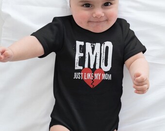May include: A black baby onesie with white text that reads "EMO JUST LIKE MY MOM" and a broken red heart graphic.