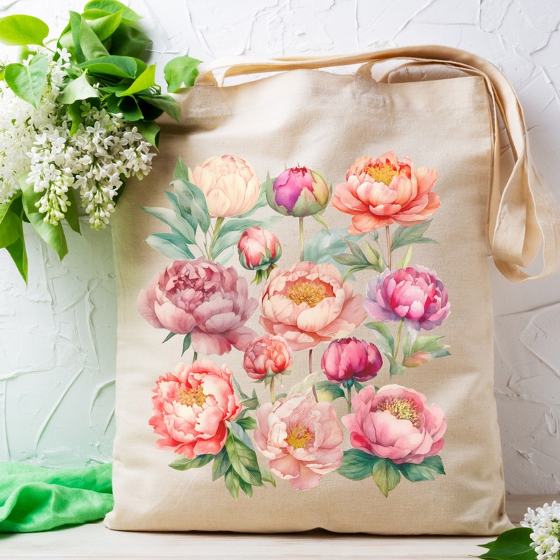May include: A beige tote bag with a floral design featuring pink, white, and red peonies. The bag has two long straps.