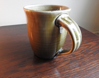 Celedon green coffee mug.