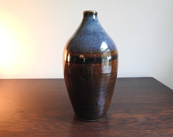 Tall blue and brown bottle