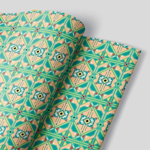 May include: A repeating pattern of geometric shapes in shades of green, orange, yellow, red, and black. The pattern is on a light peach background.