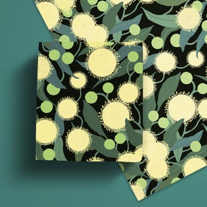May include: A black background with a repeating pattern of yellow flowers and green leaves. The flowers have a white center and a yellow outer ring. The leaves are a dark green.
