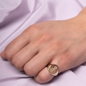 Flower Signet Ring in 14K Gold worn by a model