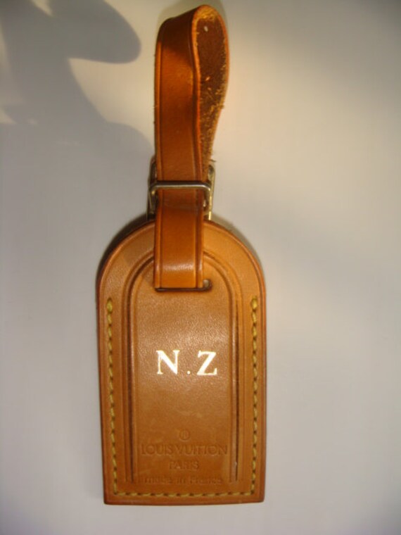 sold out beige Louis Vuitton lugagge tag keychain