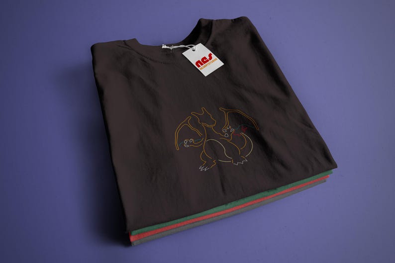 May include: A black t-shirt with a yellow outline of a dragon on the front. The shirt is folded and has a small white tag with the text "nss" on it.