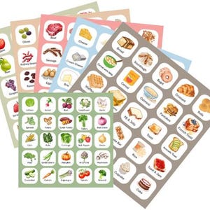 May include: A selection of food stickers with illustrations of fruits, vegetables, and food items such as bread, cheese, and meat. Each sticker has a food image and a label. The stickers are arranged in a fan shape, with a variety of colours.