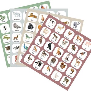 May include: Three sheets of animal stickers with watercolour illustrations. Each sticker features an animal name and image, including a frog, tiger, and cow. The stickers are in shades of green, tan, and mauve.