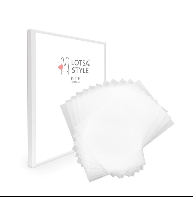May include: A stack of white DTF PET film sheets for use with a direct to film printer. The sheets are packaged in a white box with the text "Lotsa Style DTF PET Film" printed on the front.