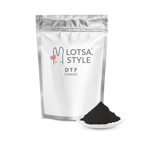 May include: A silver pouch with a white label that reads "LOTSA. STYLE DTF POWDER". A small pink heart is next to the bunny logo. A small white dish with a pile of black powder sits in front of the pouch.