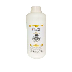 Op de afbeelding: Een witte plastic fles met witte DTF-transferinkt met het label "Lotsa. Style DTF Pro Wh Premium A+ Refill Ink Pro Tech".