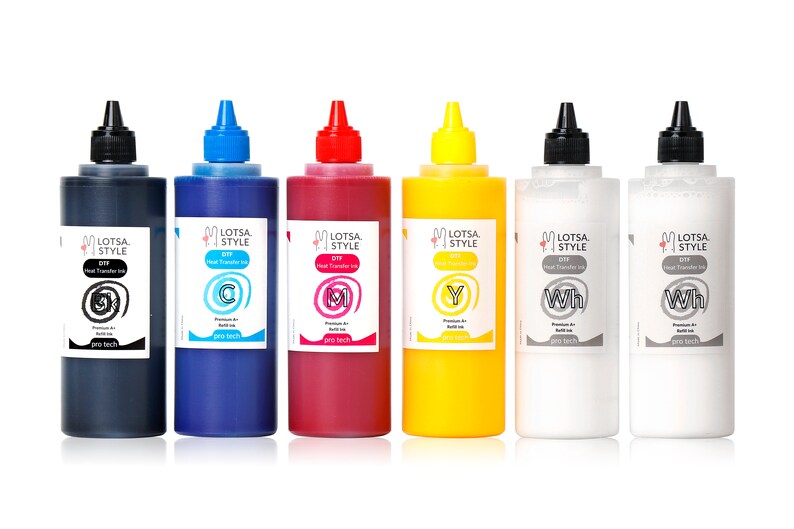 May include: Six bottles of heat transfer ink in black, cyan, magenta, yellow, and two white bottles. The bottles are labeled with the brand name "Lotsa Style" and the color of the ink. The bottles are all the same size and shape.