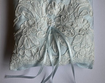 Blue faux silk Ring Pillow with ivory lace overlay blue Ribbon ties and Bead details.