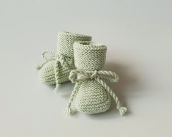 Newborn Baby Wool socks - slippers hand knitted from Oeko-Tex Merino Wool in neutral pistachio green color