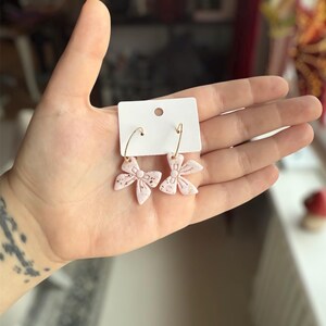 Handmade polymer clay earrings cute gold and white glitter bows