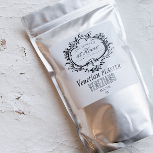 May include: A silver pouch with a white label that reads "Amy Howard at Home" and "Venetian Plaster VENEZIANO BASE 7lb".