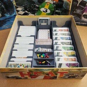 May include: A white ceramic mug with a black handle and the text "But First, Coffee" in a black, bold font. The mug is sitting on a white surface. The mug appears to be 12 ounces.