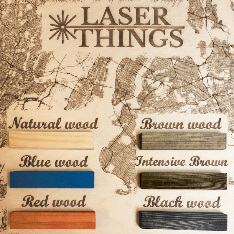 May include: A close-up of five wood samples showing different wood colors and finishes. The samples are labeled "Natural wood", "Brown wood", "Blue wood", "Intensive Brown", and "Black wood". The image also includes the text "LASER THINGS" at the top.