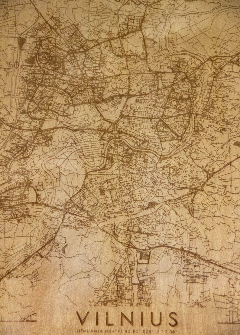 May include: A vintage-style map of Vilnius, Lithuania, with brown lines on a beige background. The map shows the city's streets and landmarks. The text "VILNIUS" is printed in a large, bold font at the bottom of the map. The text "LITHUANIA N54 41 40 90 E25 16 17 08" is printed in a smaller font below the city name.