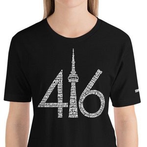 May include: Black t-shirt with a white graphic of the Toronto skyline and the number 416.