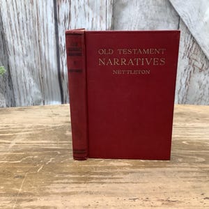 May include: A red hardcover book titled "Old Testament Narratives" by Nettleton.