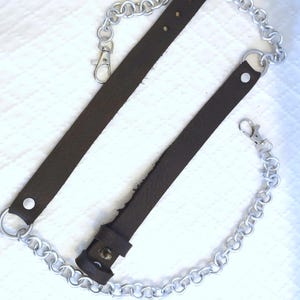 Adjustable Sporran Attachment Leather Buckle System Chain Link Design Metal Waist Clip Handcrafted Kilt Accessory Traditional Scottish Wear Custom Fit Option Multiple Color Choices Quality Material Construction Durable Metal Components