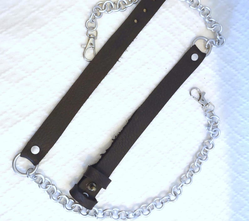 Adjustable Sporran Attachment Leather Buckle System Chain Link Design Metal Waist Clip Handcrafted Kilt Accessory Traditional Scottish Wear Custom Fit Option Multiple Color Choices Quality Material Construction Durable Metal Components
