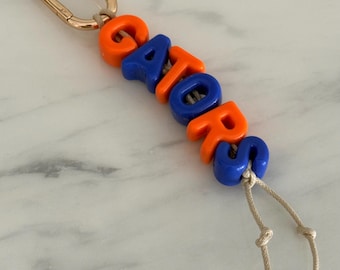 Llavero con inicial de los Florida Gators para el día del partido / Llavero con inicial de la letra / Regalo de fútbol americano azul y naranja para fiestas previas a partidos de fútbol americano universitario