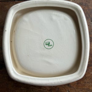 May include: A set of three ceramic nesting bowls in shades of blue, green, and white. The bowls feature a speckled glaze and a simple, modern design. The largest bowl measures approximately 6 inches in diameter.