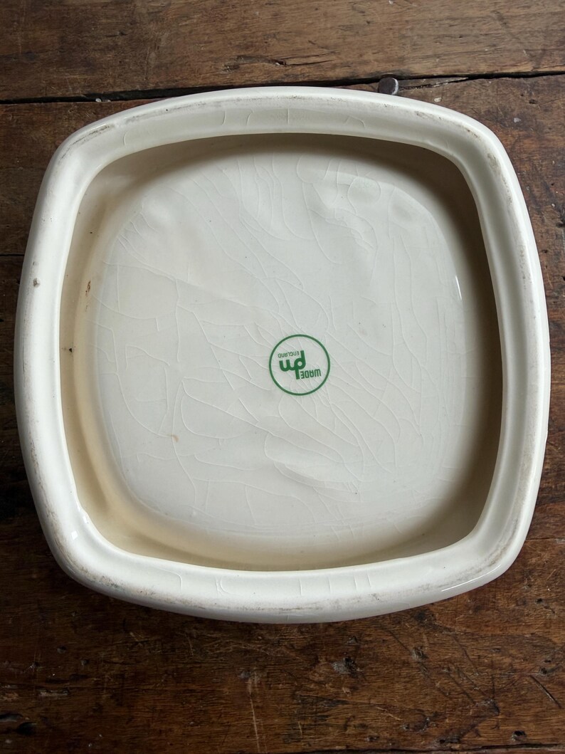 May include: A set of three ceramic nesting bowls in shades of blue, green, and white. The bowls feature a speckled glaze and a simple, modern design. The largest bowl measures approximately 6 inches in diameter.