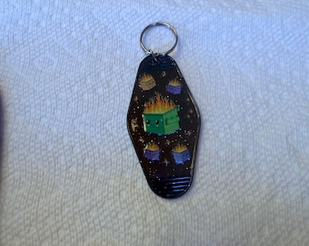 Llavero divertido con diseño de contenedor de basura en llamas