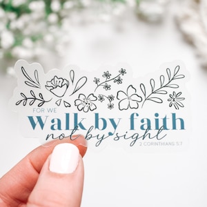 May include: A clear sticker with a floral design and the text "For we walk by faith not by sight 2 Corinthians 5:7".