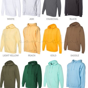 a bunch of different colors of hoodies on a white background