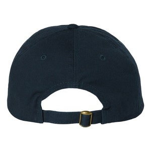 a black hat with a gold buckle on it
