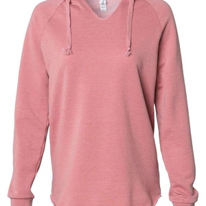 a pink sweatshirt with a hoodie on it