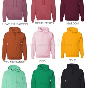 a bunch of different colors of hoodies