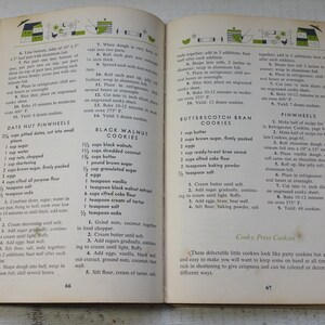 May include: An open vintage cookbook displaying pages 66 and 67 with black text on off-white paper. The pages feature recipes for Date Nut Pinwheels, Black Walnut Cookies, and Butterscotch Bran Cookies, including ingredient lists and instructions.