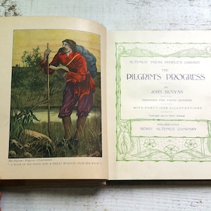 May include: An illustrated cover of a book titled "The Pilgrim's Progress" by John Bunyan. The cover features a man with a book in his hand and a large pack on his back, walking along a path with a staff. The book is arranged for young readers and includes 41 illustrations. The book is published by Henry Altemus Company in Philadelphia.