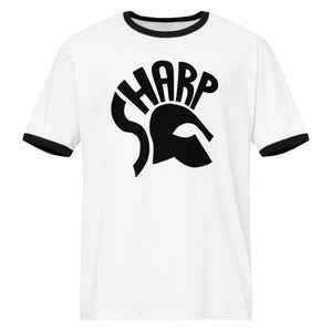 May include: White t-shirt with black trim on the collar and sleeves. The shirt features a black graphic of a Spartan helmet with the word "SHARP" incorporated into the design. A casual, everyday apparel item.