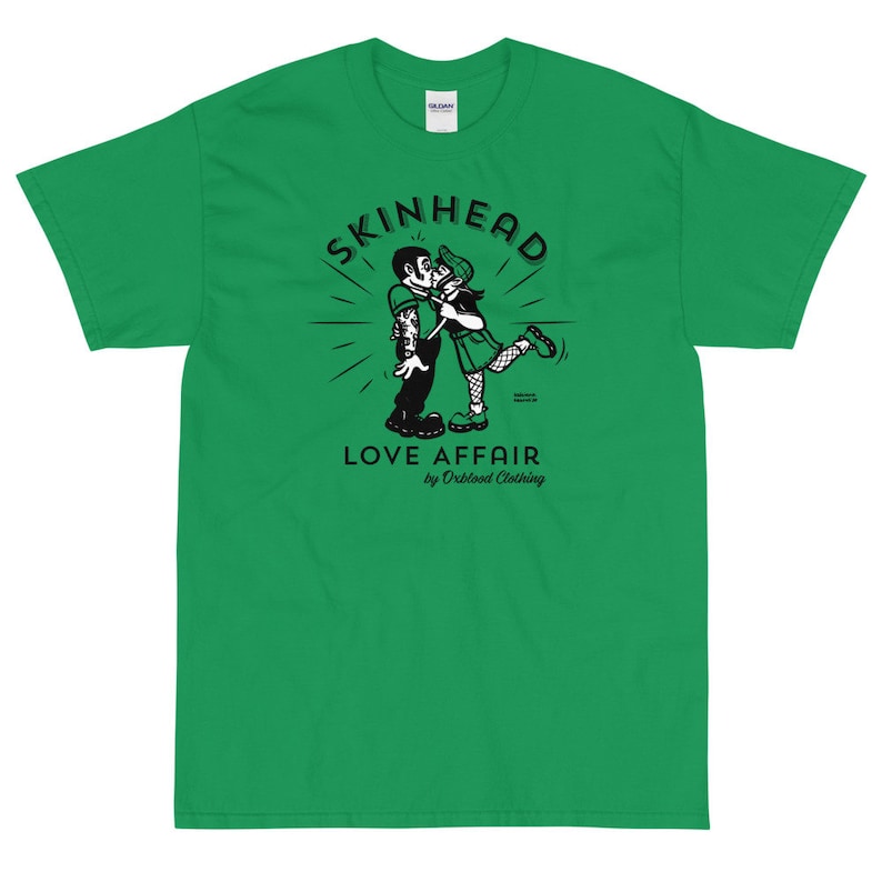 May include: Green t-shirt with a black and white illustration of a couple kissing. The illustration is surrounded by a circle with the text "SKINHEAD LOVE AFFAIR by Orblood Clothing".