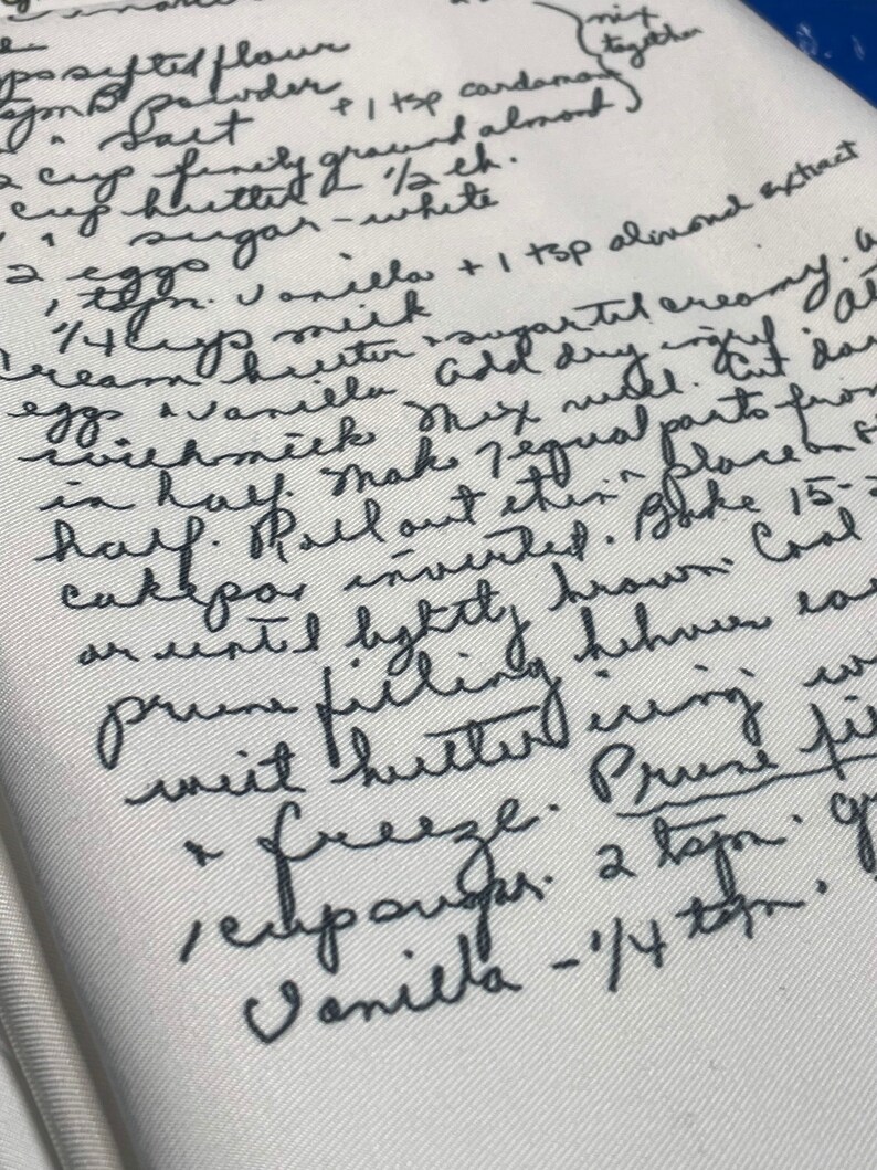 May include: Handwritten recipe for a cake with instructions for making the cake and filling. The recipe includes ingredients such as flour, sugar, eggs, vanilla, and almond extract. The recipe also includes instructions for freezing the cake and filling.