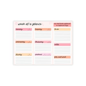May include: A weekly planner with a light pink background. The planner has sections for each day of the week, with the days of the week written in black script. The top of the planner says "week at a glance" and "our best looks different on different days".